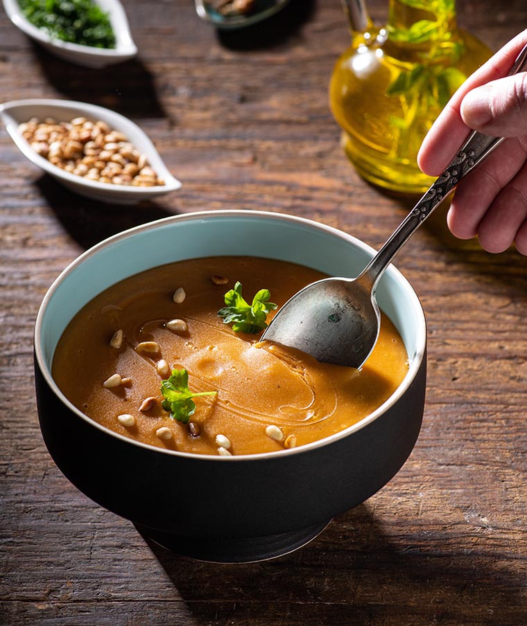 Lentil cream soup with pine nuts and croutons